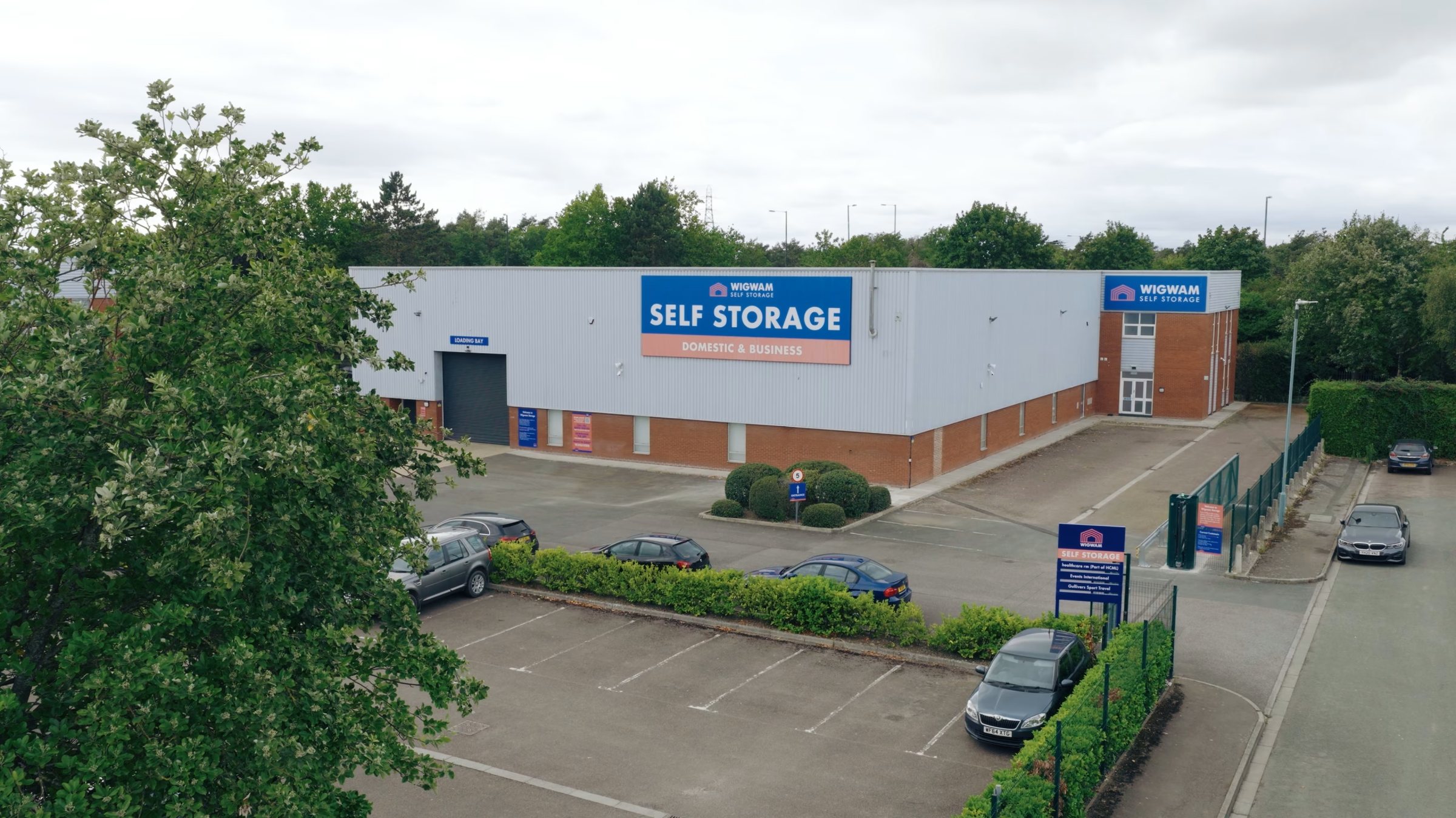 A modern self-storage facility converted from industrial units, with clean signage, secure access gates, and bright exterior lighting — representing how commercial properties can be transformed into profitable, professionally managed storage spaces.